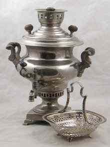 Appraisal: An impressive nickel plated Russian samovar on square base cm