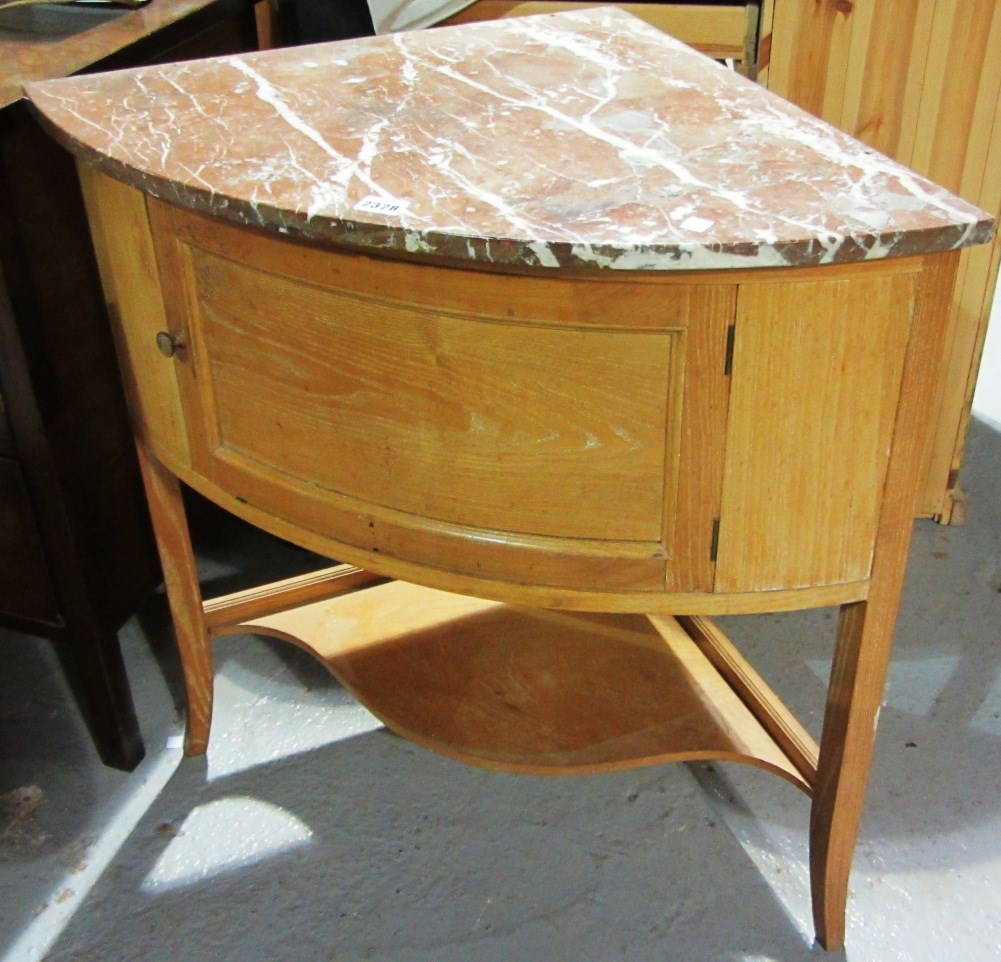 Appraisal: An oak corner cabinet with red vein marble top