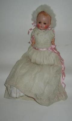 Appraisal: A Continental tinted bisque head girl doll with blue glass