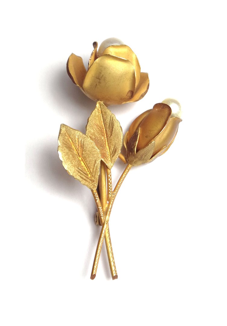 Appraisal: A gold and cultured pearl brooch designed as a flower