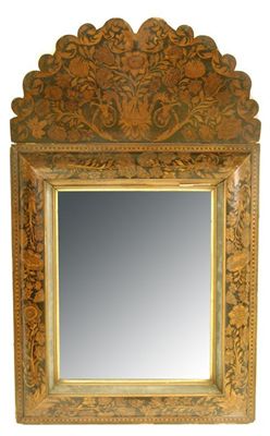 Appraisal: A Flemish floral marquetry cushion frame mirror with an ebonised