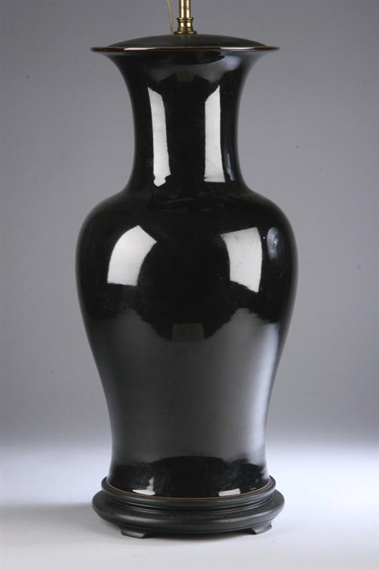 Appraisal: CHINESE MIRROR BLACK PORCELAIN BALUSTER-FORM VASE th century Electrified drilled