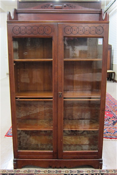 Appraisal: LATE VICTORIAN CABINET BOOKCASE American c having three adjustable wood