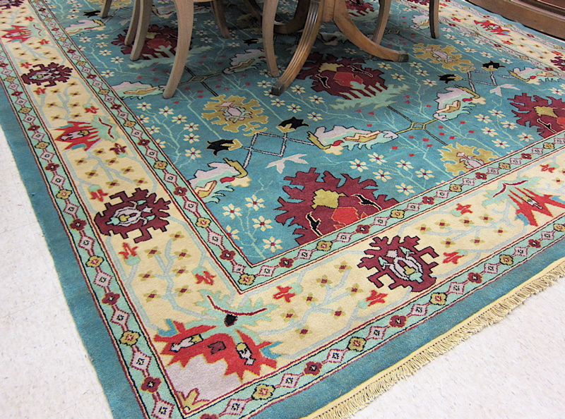 Appraisal: HAND KNOTTED ORIENTAL CARPET Indo-Persian featuring a green field of