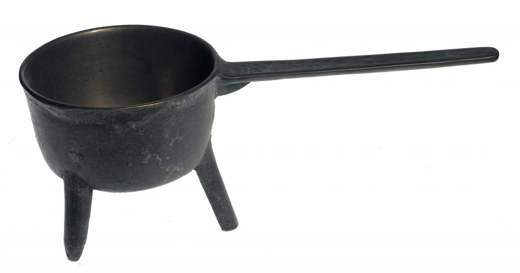 Appraisal: AN ENGLISH LEAD-BRONZE SKILLET the handle cast with the inscription