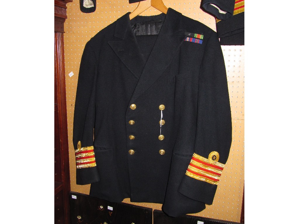 Appraisal: Lot comprising three Royal Navy uniforms and a Greatcoat coat