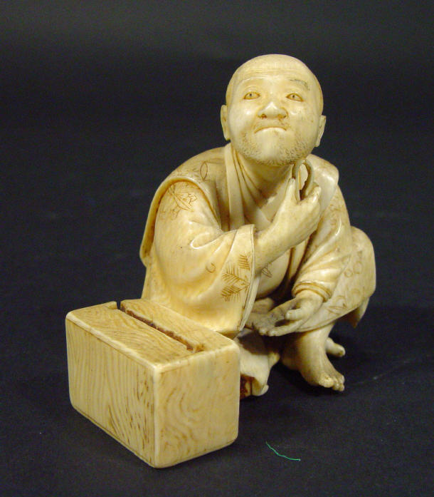 Appraisal: Oriental ivory okimono in the form of a male grooming