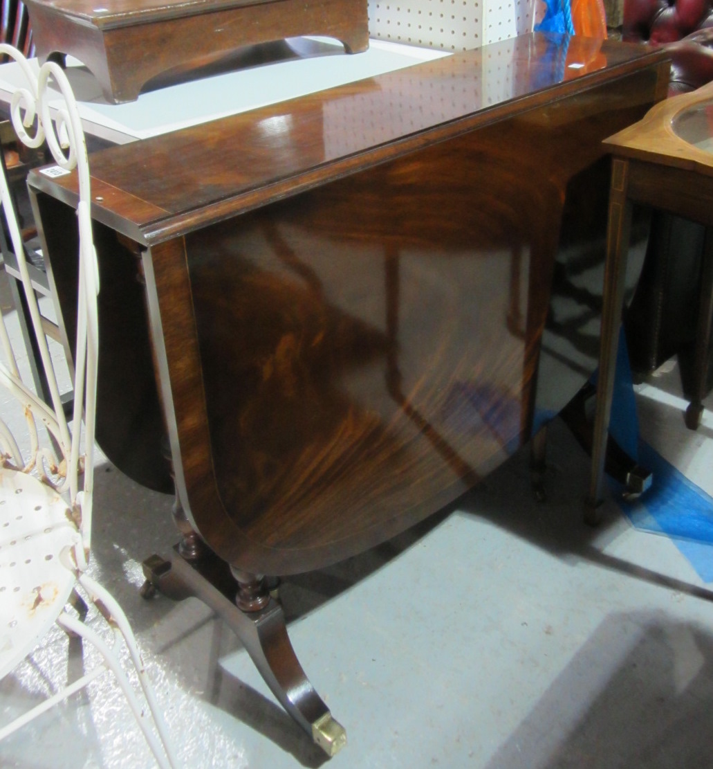 Appraisal: A th century mahogany drop flap Sutherland table