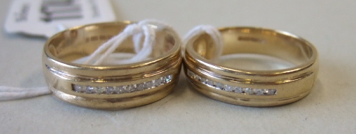 Appraisal: Two ct gold and diamond set band rings each mounted