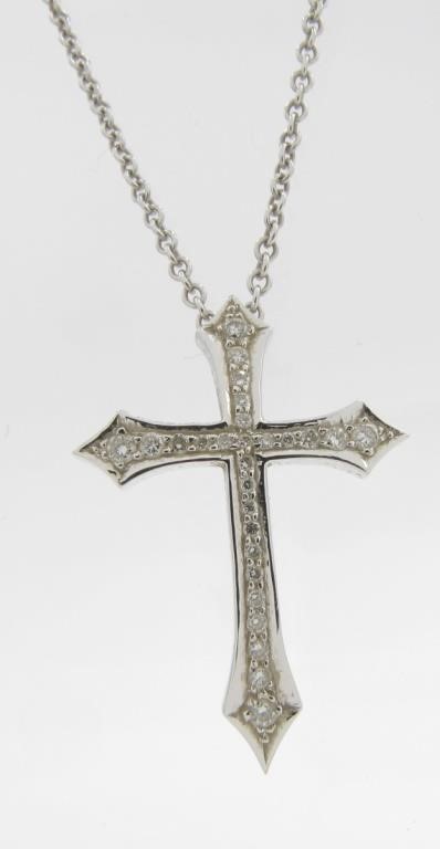 Appraisal: An K white gold cross pendant in curved design measuring