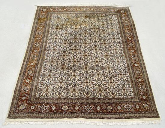 Appraisal: HAND TIED WOOL PERSIAN CARPET Repeating all over floral design