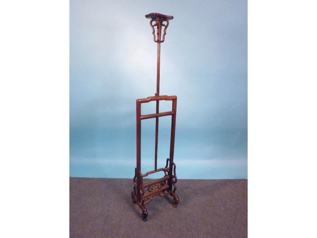 Appraisal: A Chinese hardwood clothes stand on shape supports possibly thC