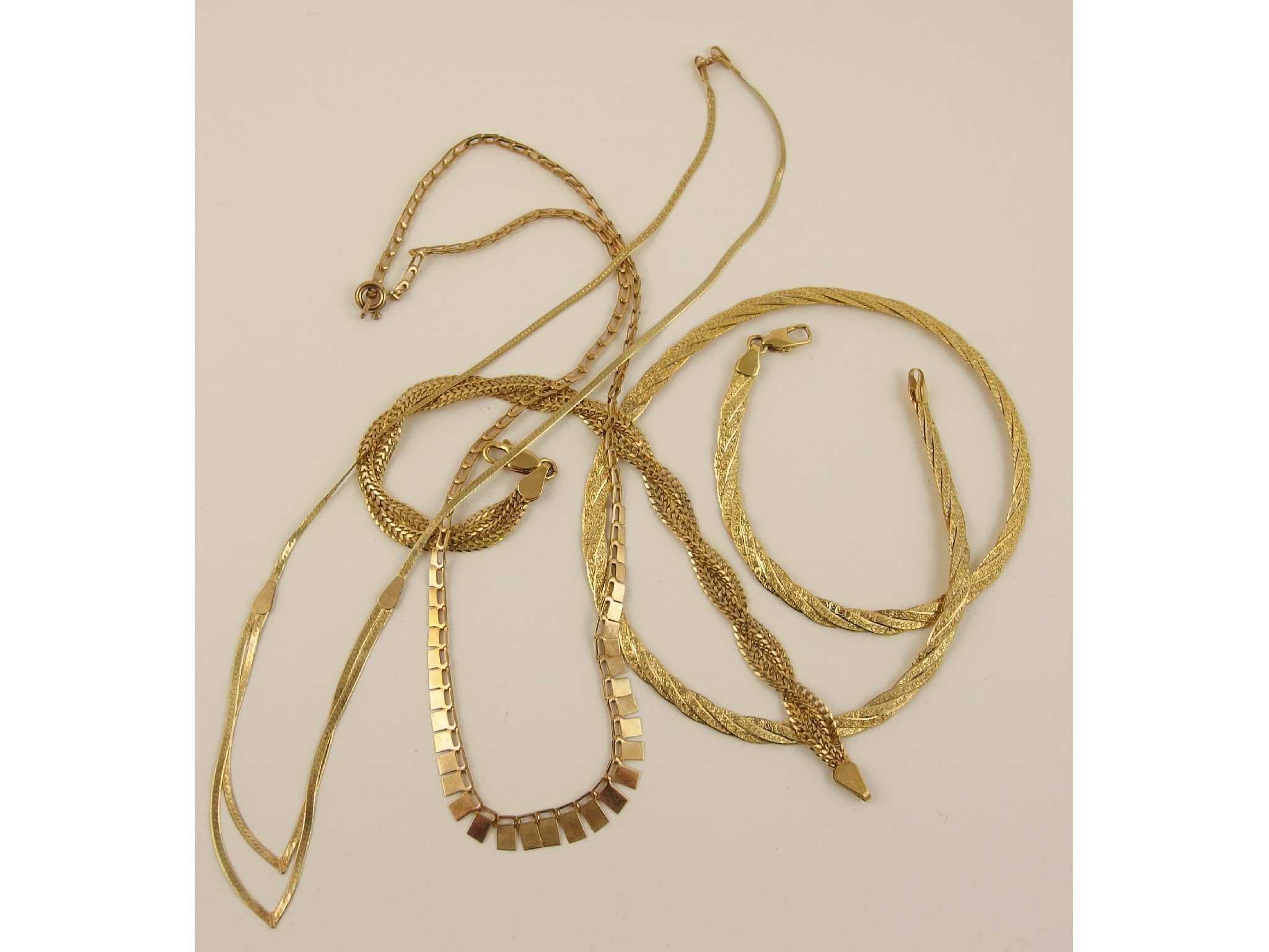 Appraisal: Three decorative ct neck chains and a ct twisted chain