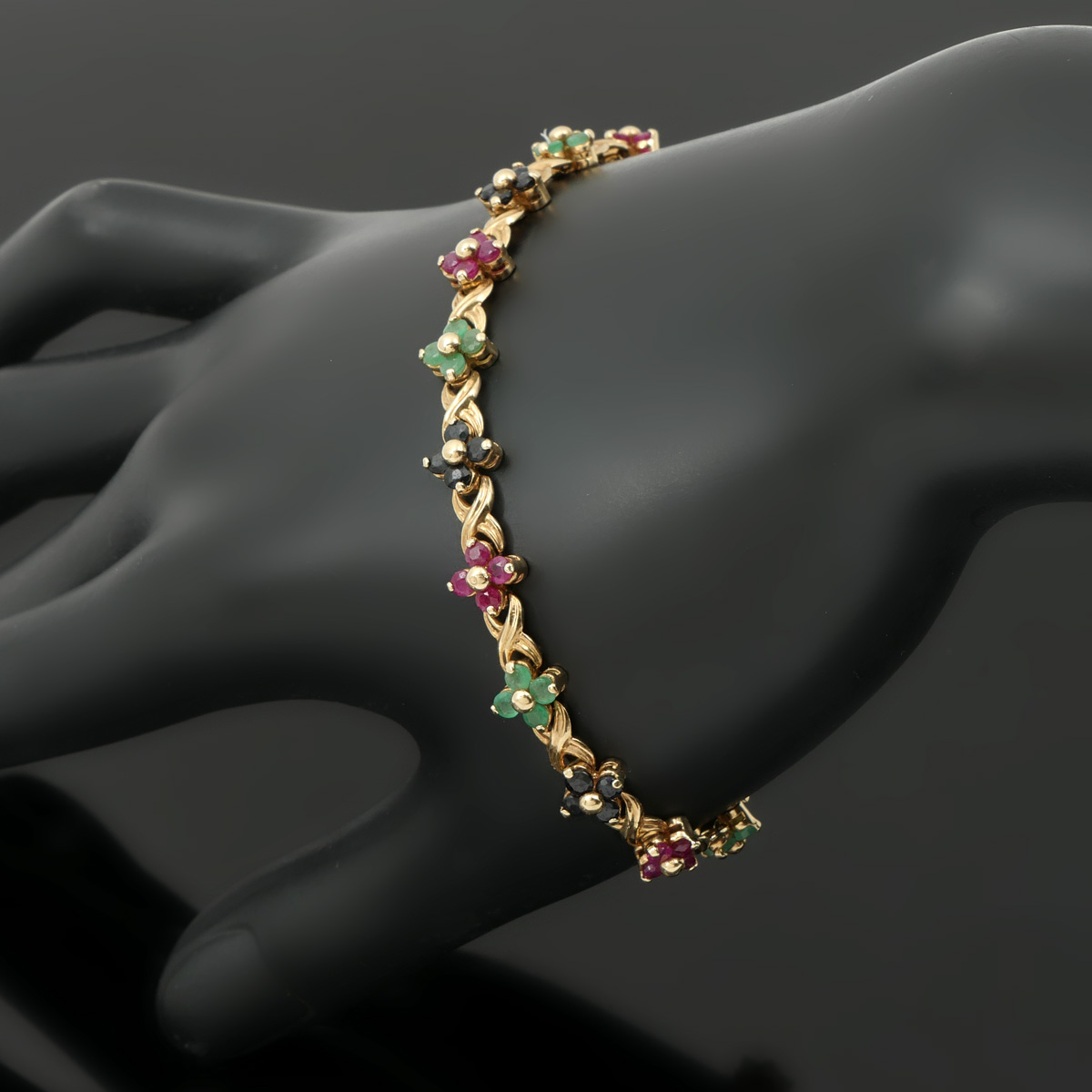 Appraisal: K GEMSTONE BRACELET K yellow gold bracelet contains round faceted