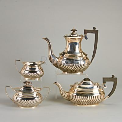 Appraisal: ENGLISH STERLING COFFEE SERVICE Four cushion-shaped half-reeded pieces made by