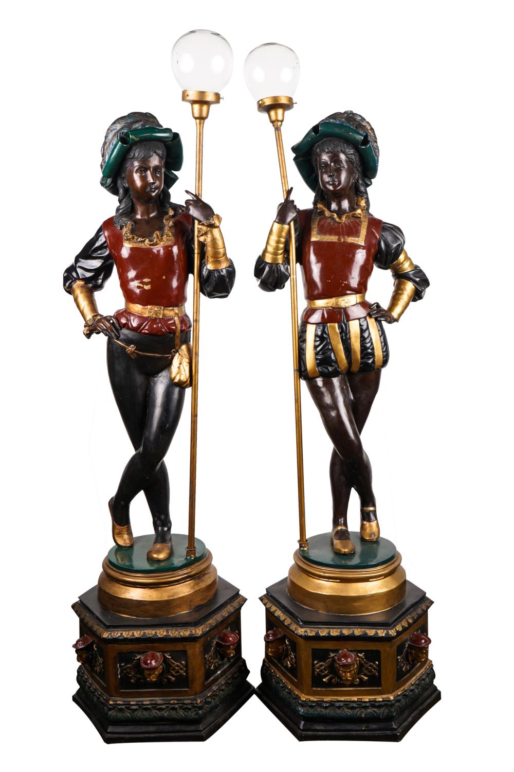 Appraisal: PAIR OF PATINATED BRONZE FIGURAL TORCHIERESeach mounted to base inches