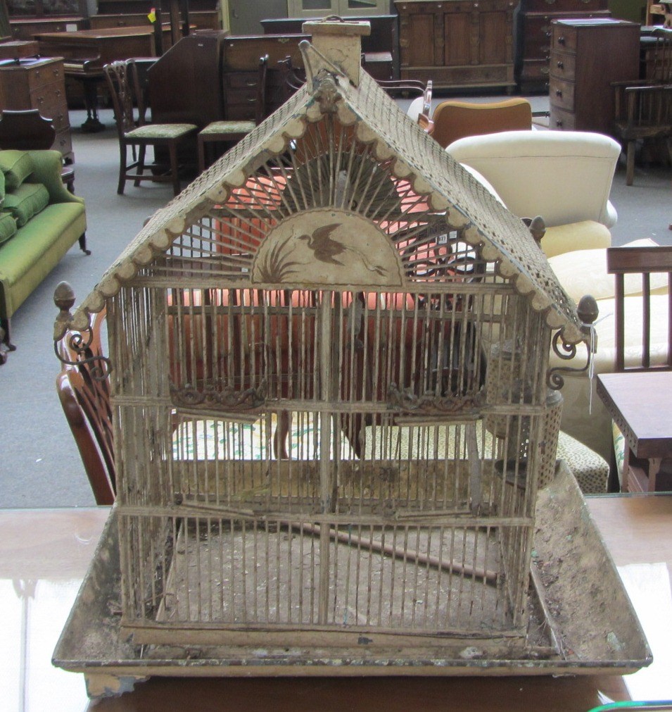 Appraisal: A painted metal birdcage early th century the pierced pitched