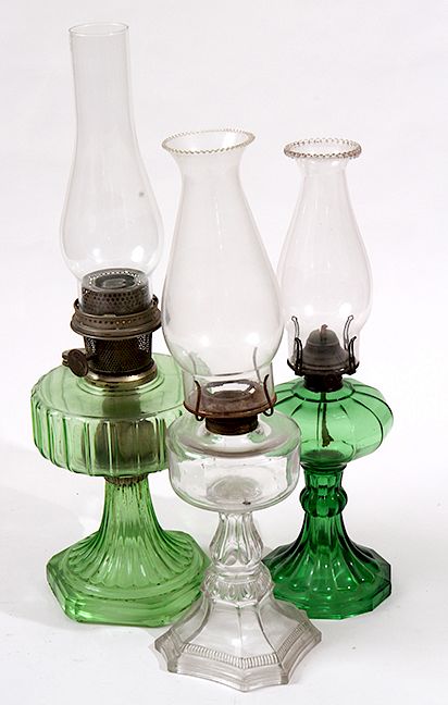 Appraisal: Oil Lamp Group Two oil lamps and one Aladdin lamp