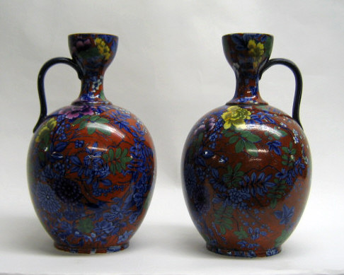 Appraisal: PAIR OF CAULDON FLOW BLUE PORCELAIN JUGS Each bottle-form with