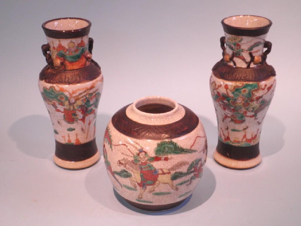 Appraisal: A pair of Chinese famille vert vases and a similar