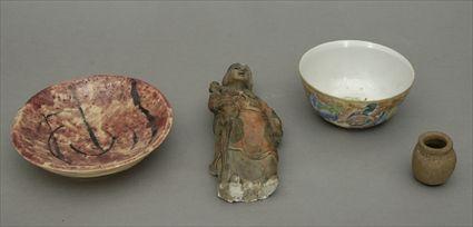 Appraisal: Asian Glazed Pottery Figure Together with a Chinese porcelain bowl