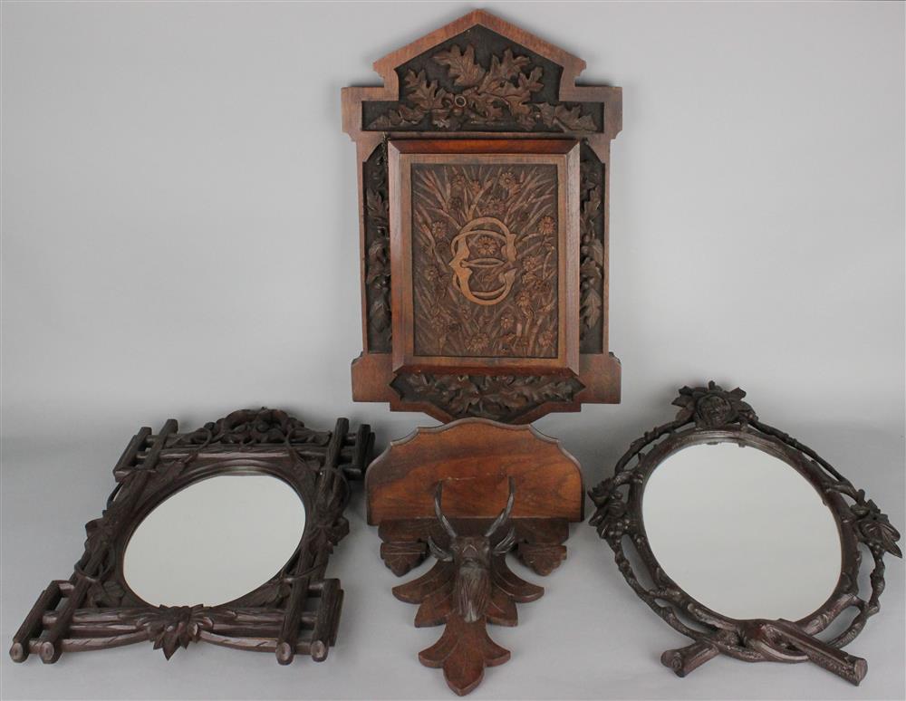 Appraisal: FOUR BLACK FOREST TYPE CARVED WOOD PIECES including a wall-mounted