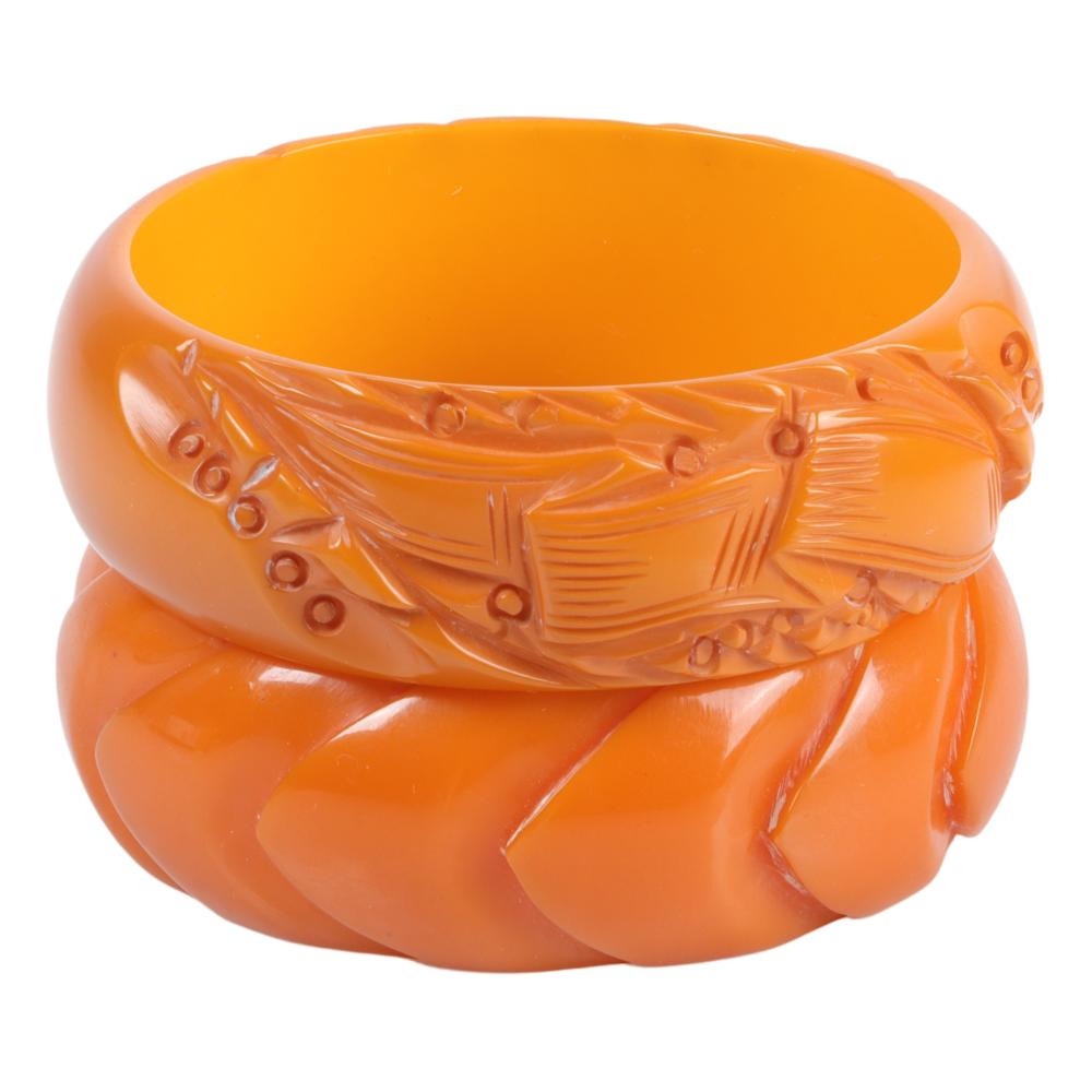 Appraisal: TWO TANGERINE BAKELITE FLAT WALLED BRACELETS H X INNER DIAM