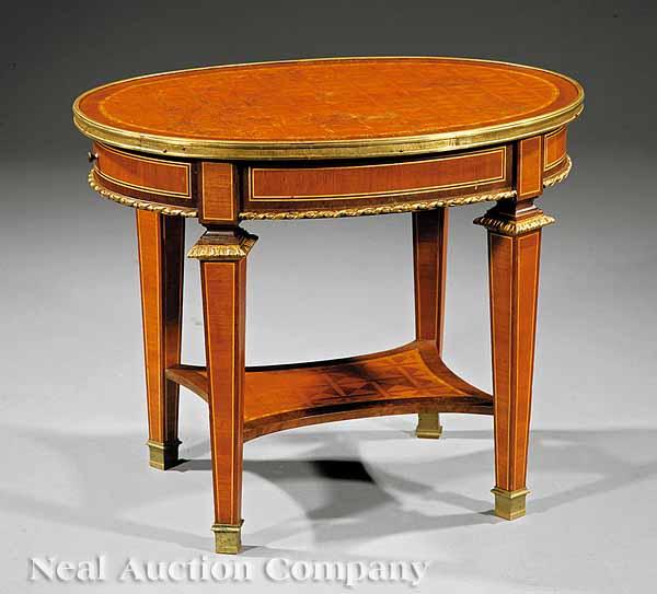 Appraisal: A Louis XVI-Style Parquetry Inlaid Bronze-Mounted Mahogany Occasional Table th