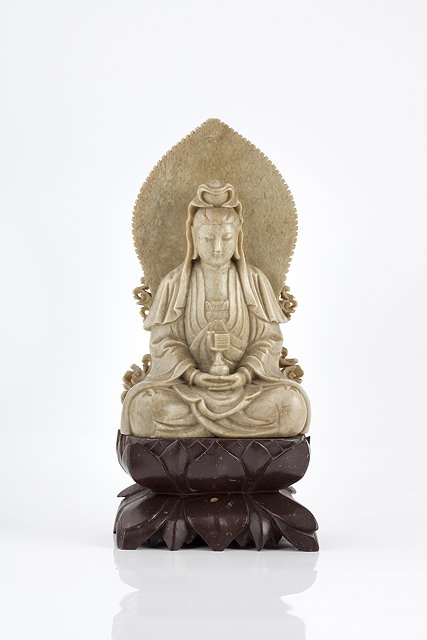 Appraisal: A Chinese grey soapstone figure of a seated Guanyin th