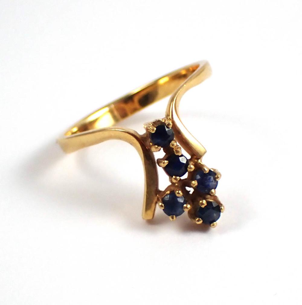 Appraisal: SAPPHIRE AND EIGHTEEN KARAT GOLD RING set with five round-cut