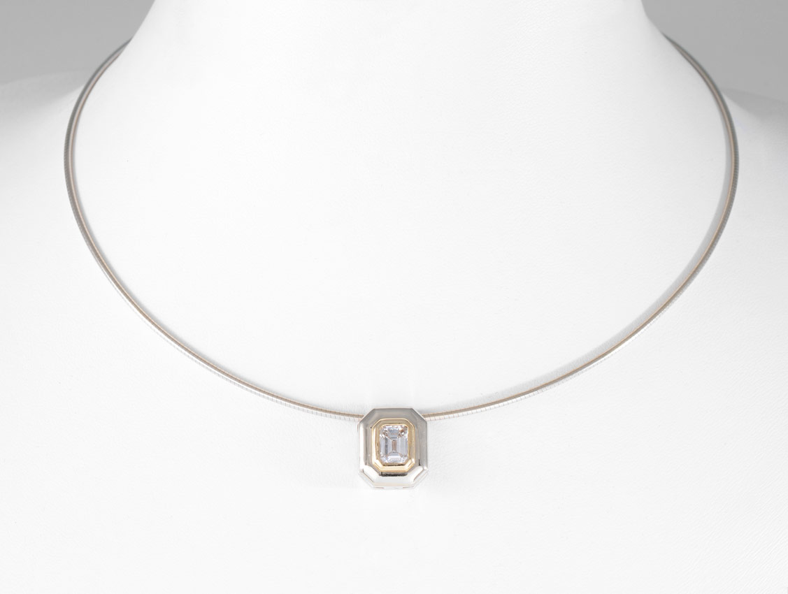 Appraisal: EMERALD CUT DIAMOND PENDANT NECKLACE K white gold pendant centers