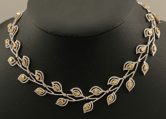 Appraisal: A yellow and white diamond set collar Comprising forty two