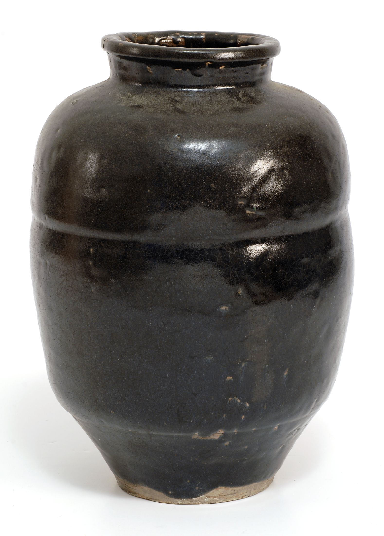 Appraisal: BLACK GLAZE POTTERY STORAGE JAR th CenturyIn ovoid form Height