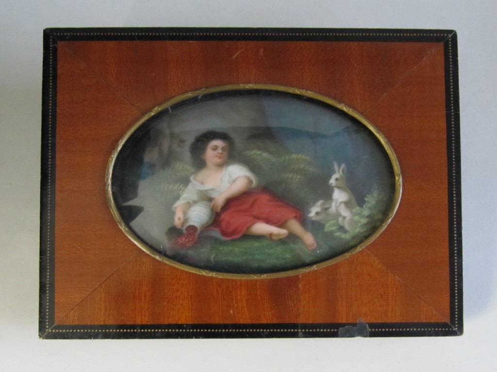 Appraisal: A continental porcelain oval plaque painted with a child lying