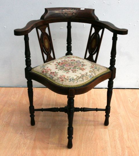 Appraisal: An Edwardian mahogany and inlaid corner chair