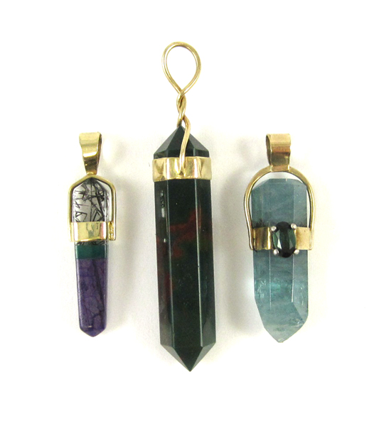 Appraisal: THREE HEALING CRYSTAL PENDULUM PENDANTS two measuring - inches in