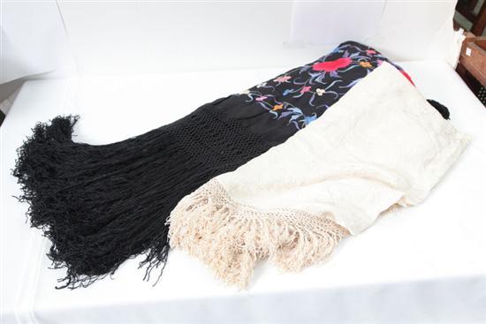 Appraisal: TWO SILK SHAWS A large black piano shawl with vibrant