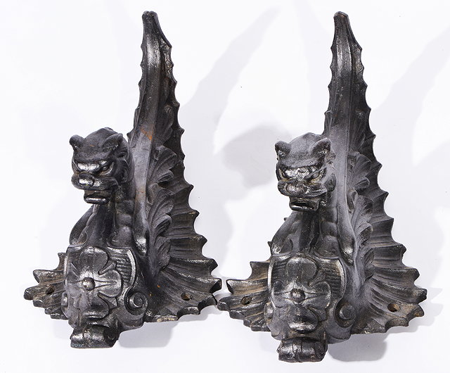 Appraisal: A PAIR OF CAST IRON DRAGON BRACKETS with open snarling