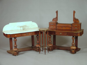 Appraisal: A Victorian mahogany wash stand the variegated white marble top