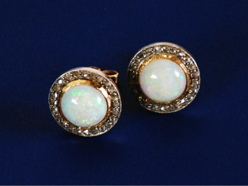 Appraisal: PAIR OF CIRCULAR OPAL AND DIAMOND CLUSTER STUD EARRINGS each