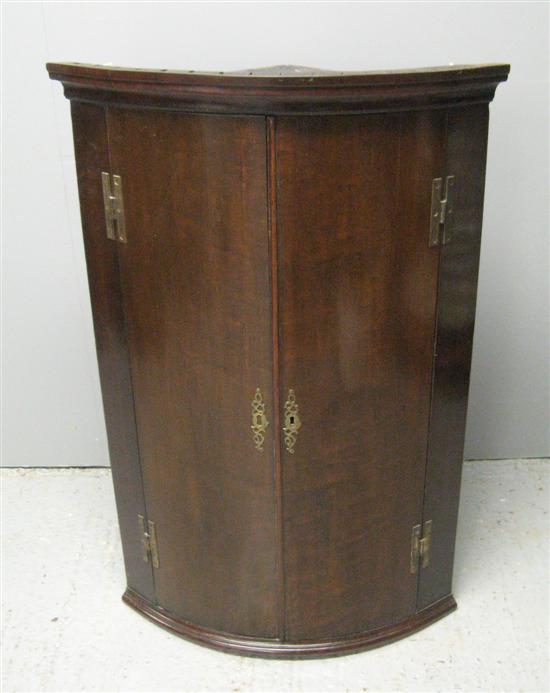 Appraisal: George III bow front mahogany wall cabinet h w in