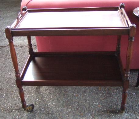 Appraisal: A mahogany framed two tier serving trolley the top with