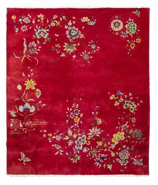 Appraisal: A Chinese Wool Rug decorated with sprays of flowers upon