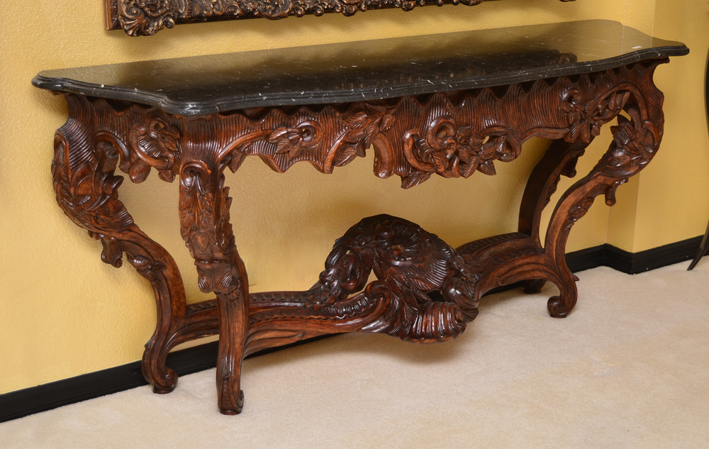 Appraisal: MARBLE TOP CARVED CONSOLE TABLE Shaped variegated black marble top