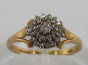 Appraisal: A carat yellow gold and diamond cluster ring the tiered