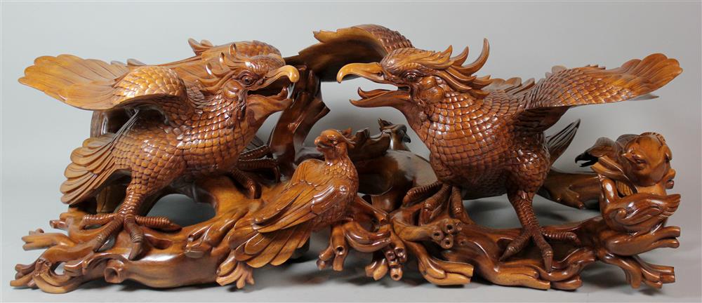 Appraisal: LARGE INDONESIAN WOOD CARVING OF BIRDS the intricately carved pair