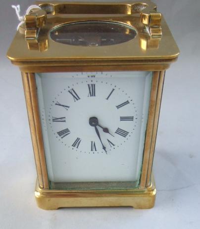 Appraisal: A late th century French lacquered brass carriage timepiece with