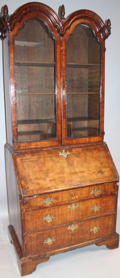 Appraisal: A Queen Anne walnut double dome top bureau bookcase the