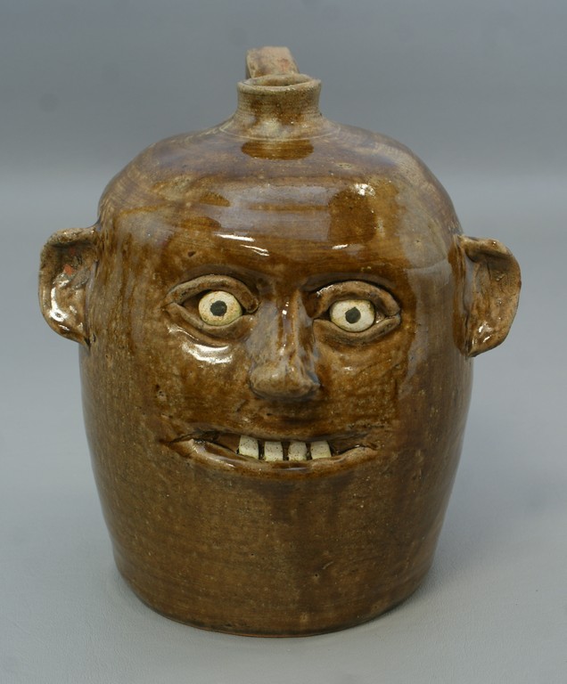 Appraisal: Reggie Meaders pottery face jug inscribed Reggie Meaders - h