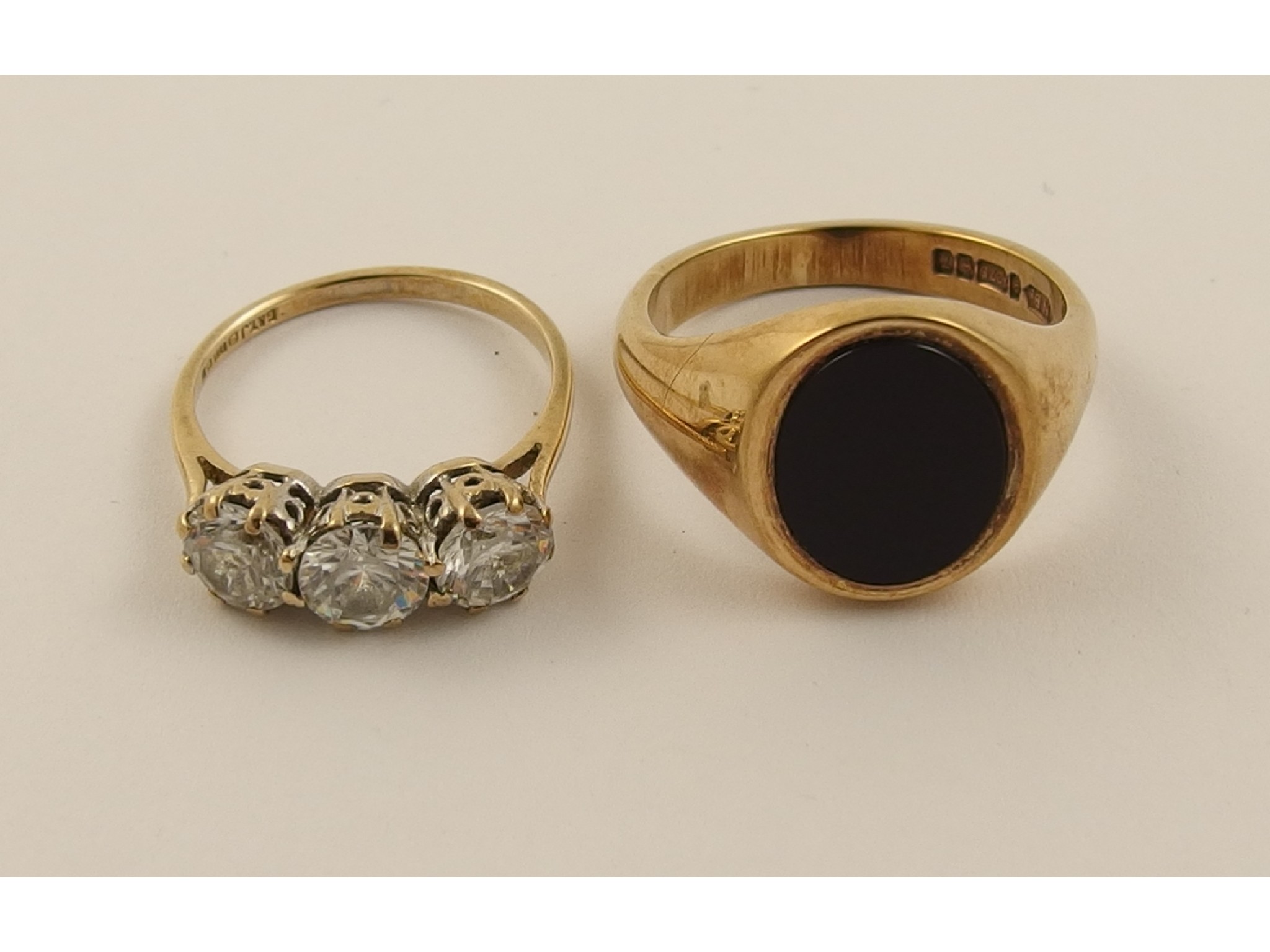 Appraisal: A ct gents onyx signet ring and a ct clear